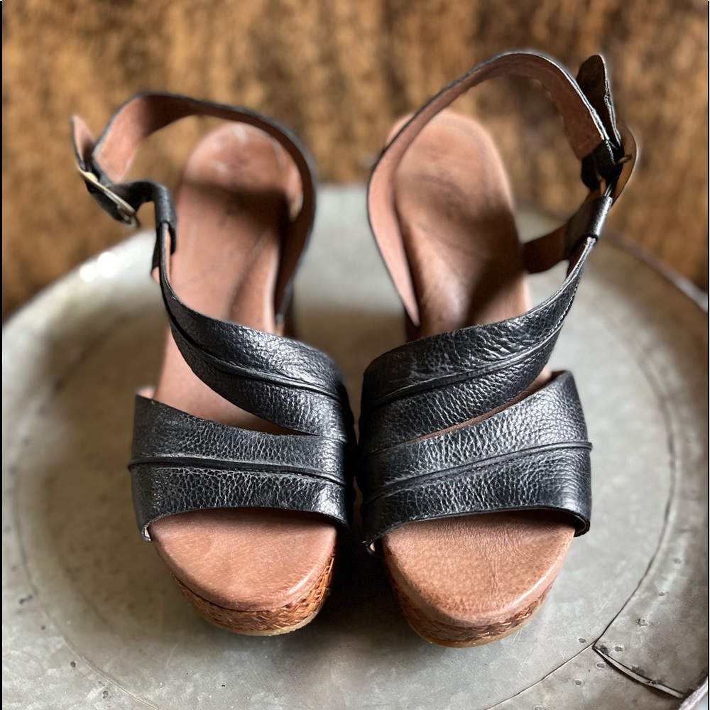 Size 9 born wedge black sandal. Never worn and in mint condition.